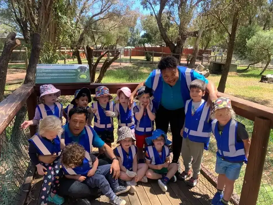 Bluebird educators and children together outdoors